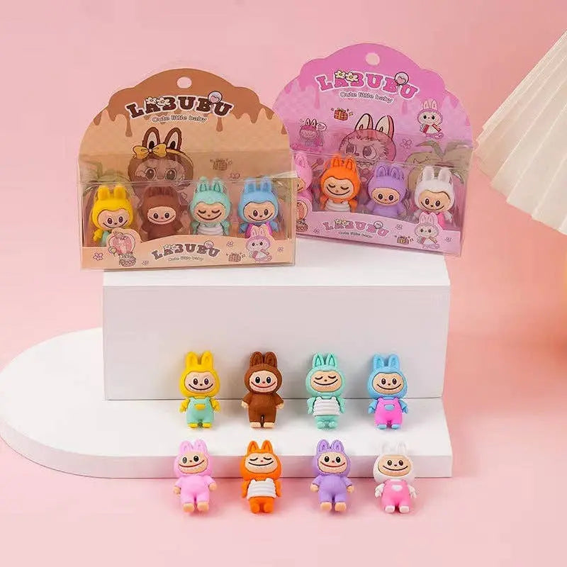 Set of colorful cartoon character figurines with packaging on a pink background
