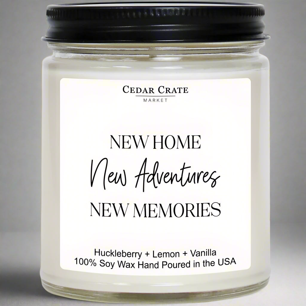 Candle jar with a label reading 'New Home New Adventures New Memories' by Cedar Crate Market.