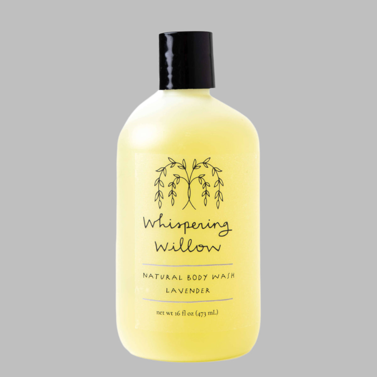 Yellow bottle of Whispering Willow natural body wash on a gray background