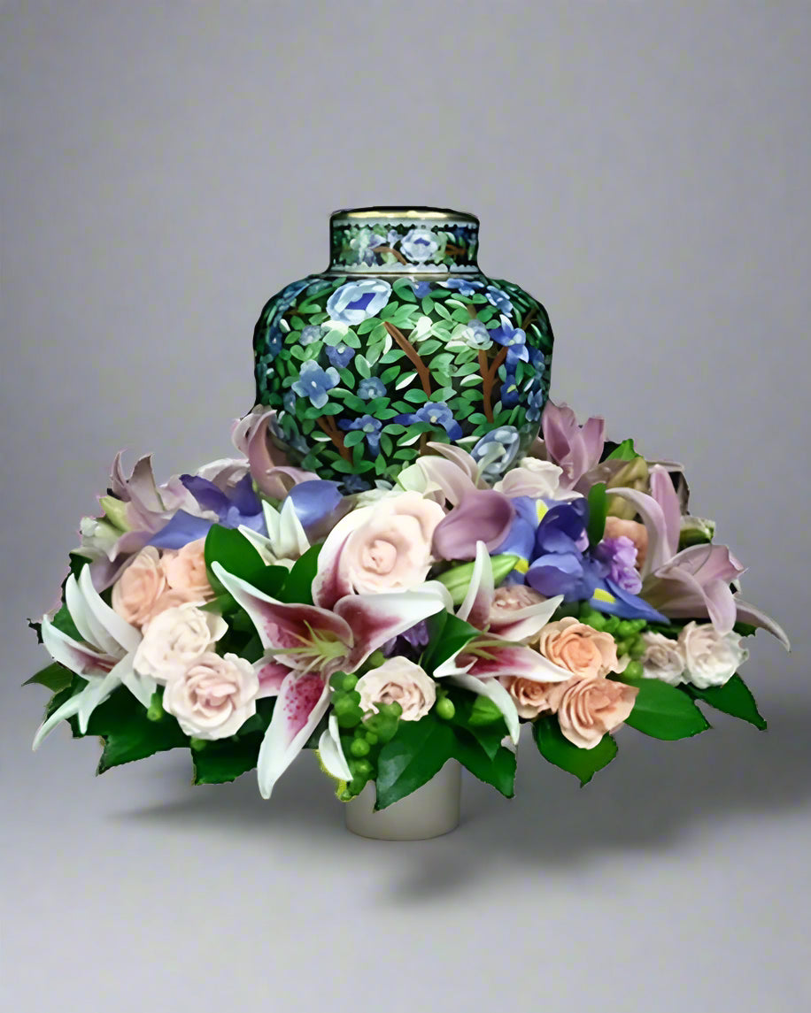 Decorative urn with floral arrangement on a white background
