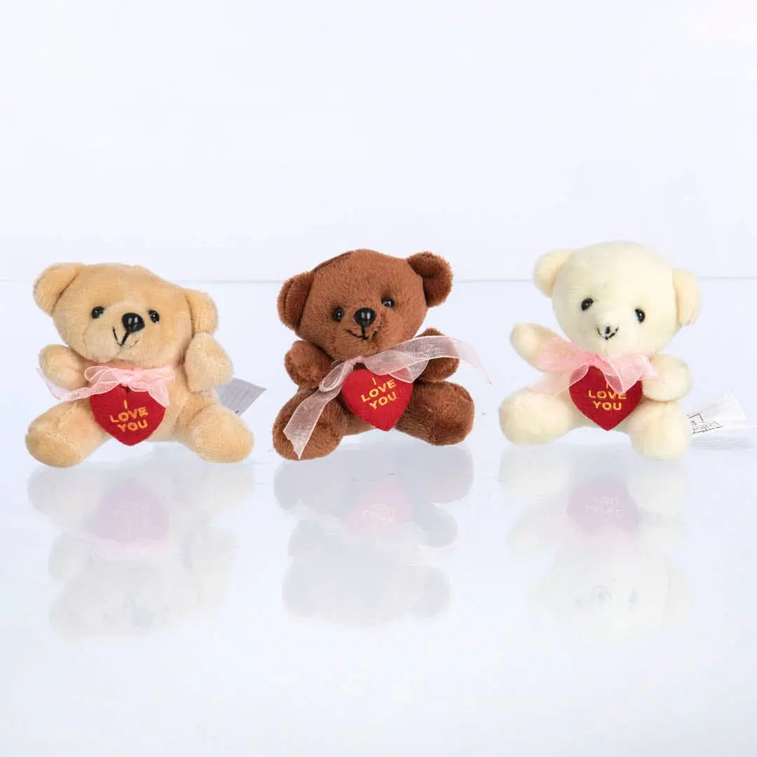 Valentine's Day gift basket with chocolates and a teddy bear on a wooden surface.