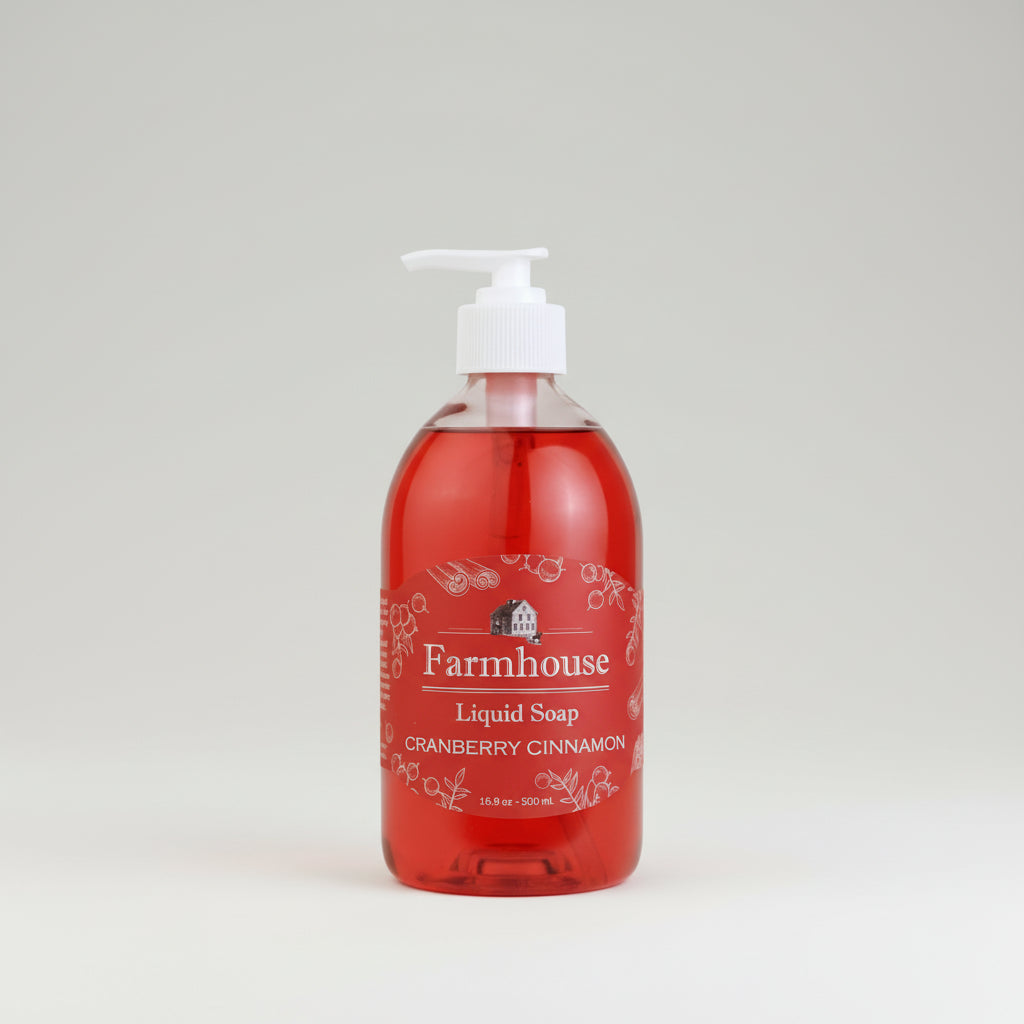 Red bottle of Farmhouse Liquid Soap with cranberry cinnamon scent on a white background