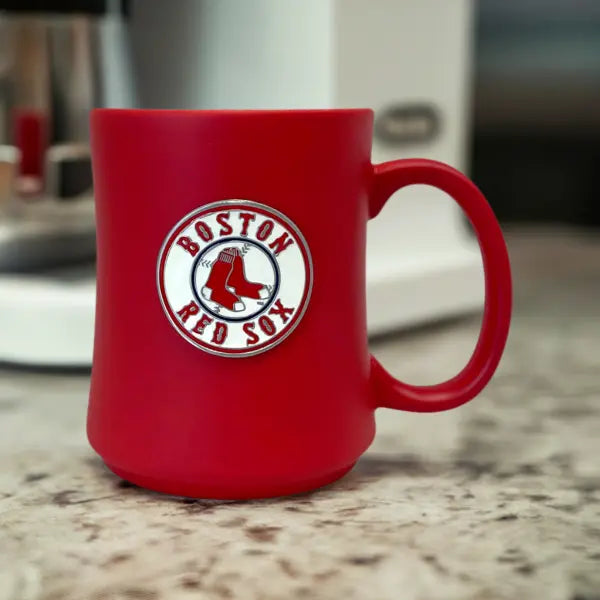 Red mug with Boston Red Sox logo on a kitchen counter