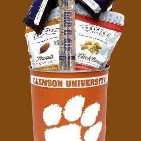Gift basket with snacks in a Clemson University-themed container on a brown background