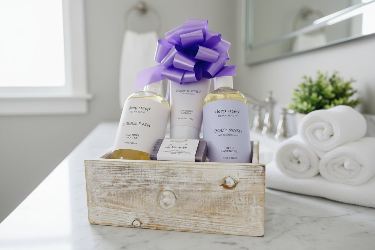 Gift set with Deep Steep bubble bath, body wash, and body butter in a wooden box with a purple bow.