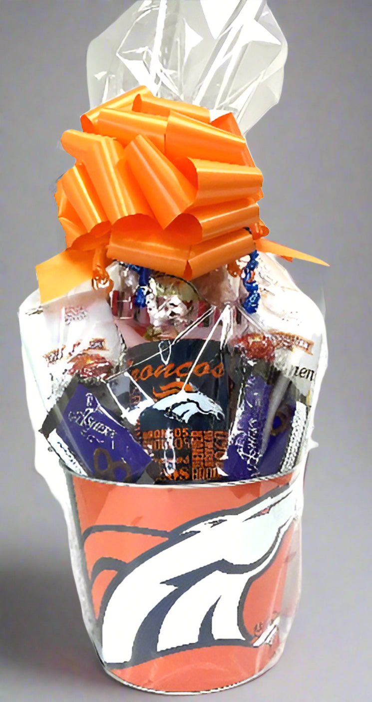 Gift basket with Denver Broncos theme featuring candy and a large orange bow on a gray background