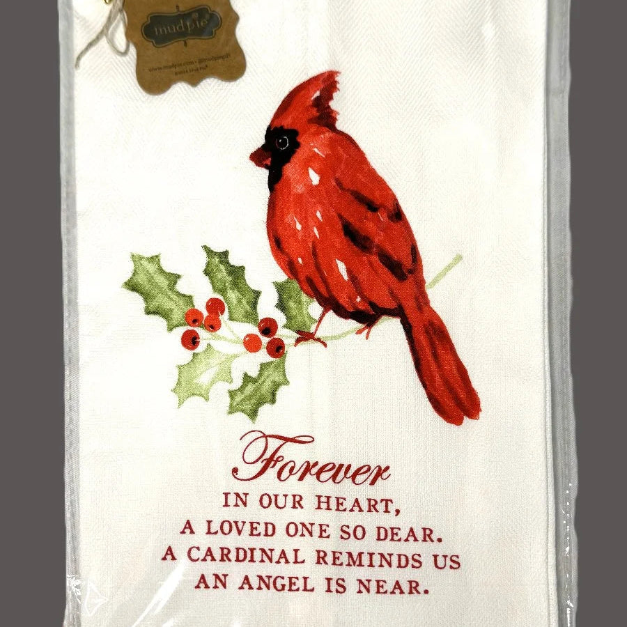 Packaged product with a red cardinal and holly design on a white background