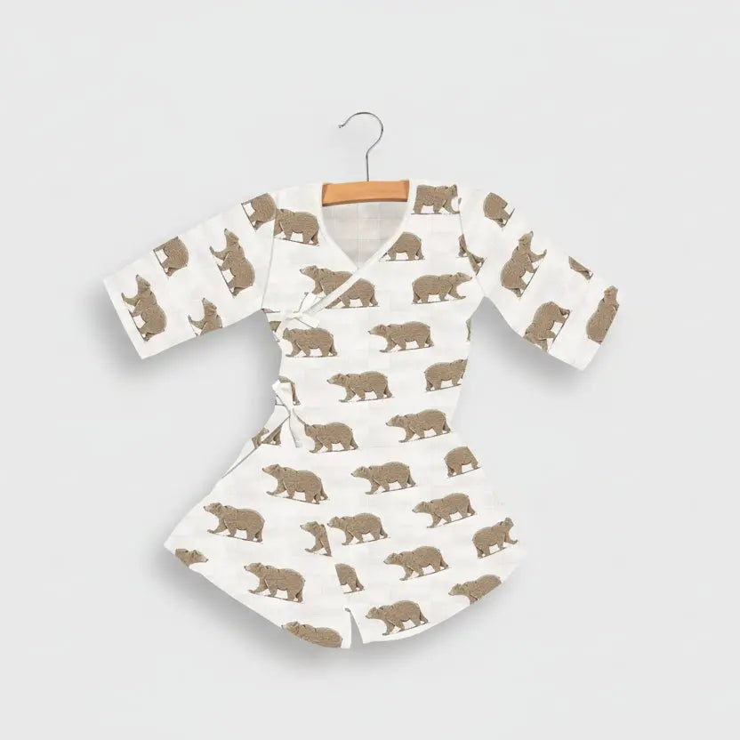 Baby outfit with bear pattern on a white background