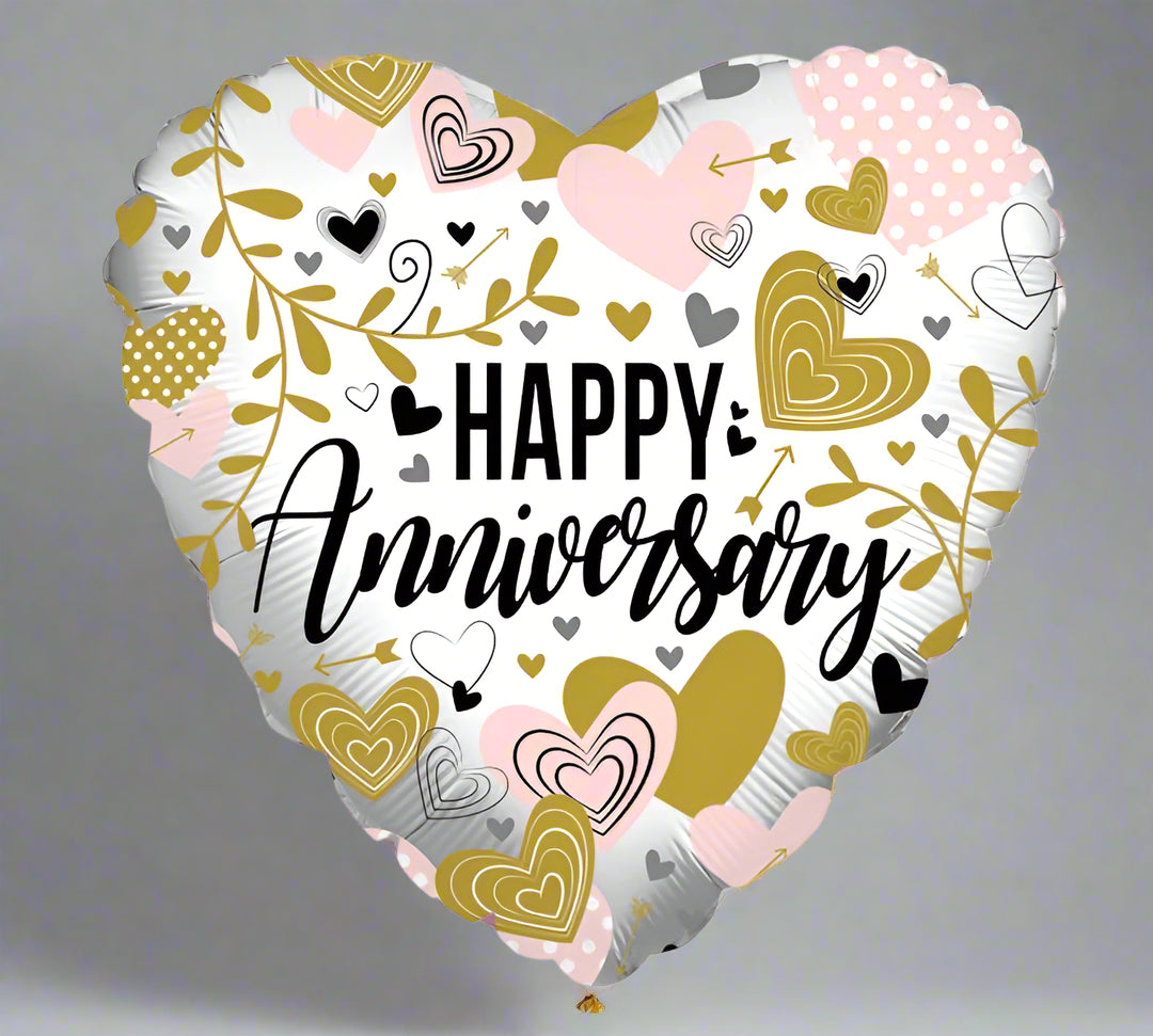 Heart-shaped balloon with 'Happy Anniversary' text and decorative hearts 
