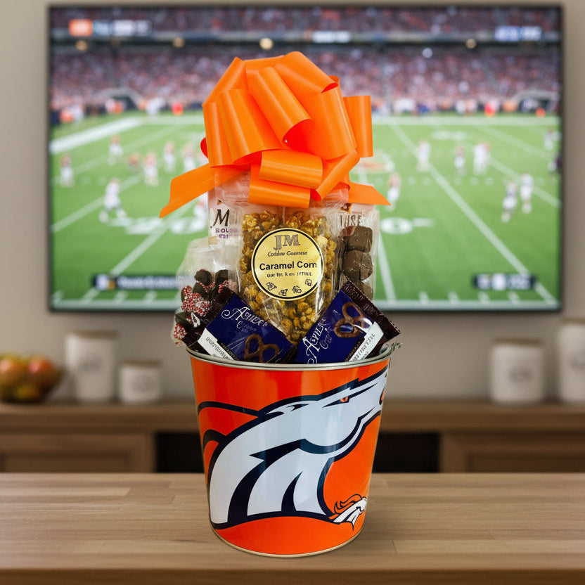 Gift basket with a Denver Broncos logo on a wooden surface