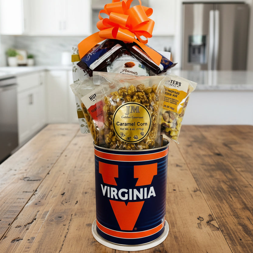 Gift basket with snacks in a Virginia-themed container on a wooden surface.