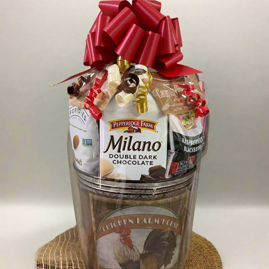Gift basket with Milano chocolate and other items on a woven surface