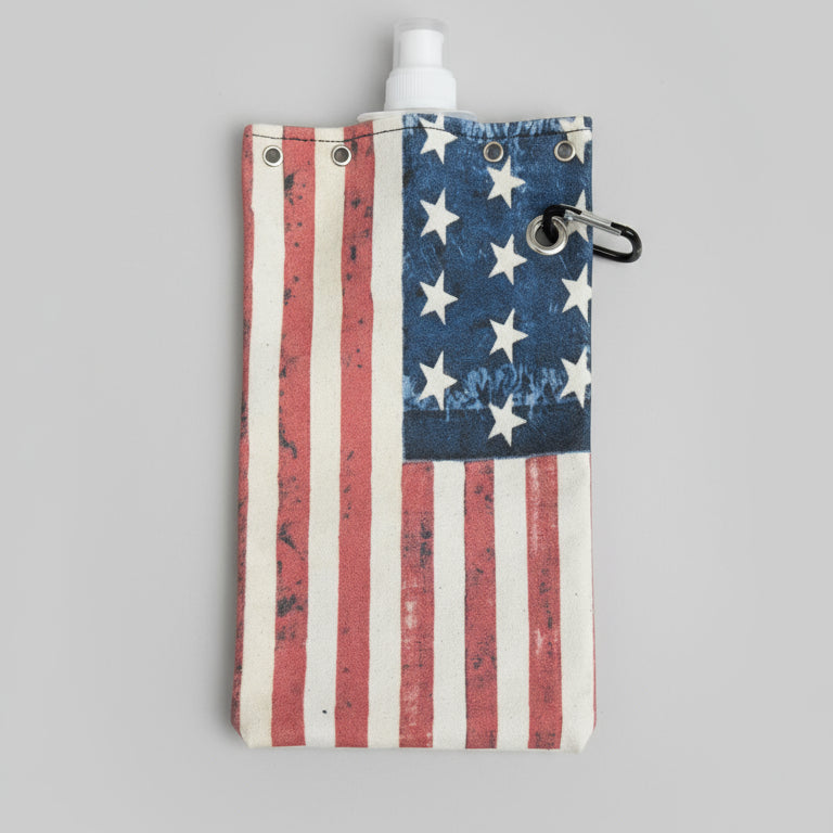 American flag patterned pouch with a water bottle on a wooden surface