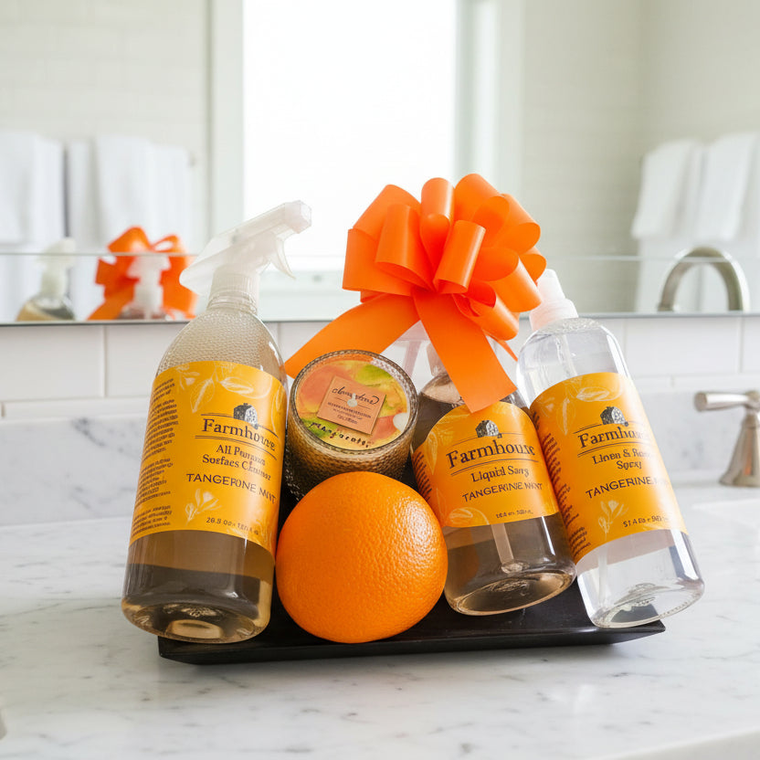 Farmhouse cleaning products with an orange on a wooden surface