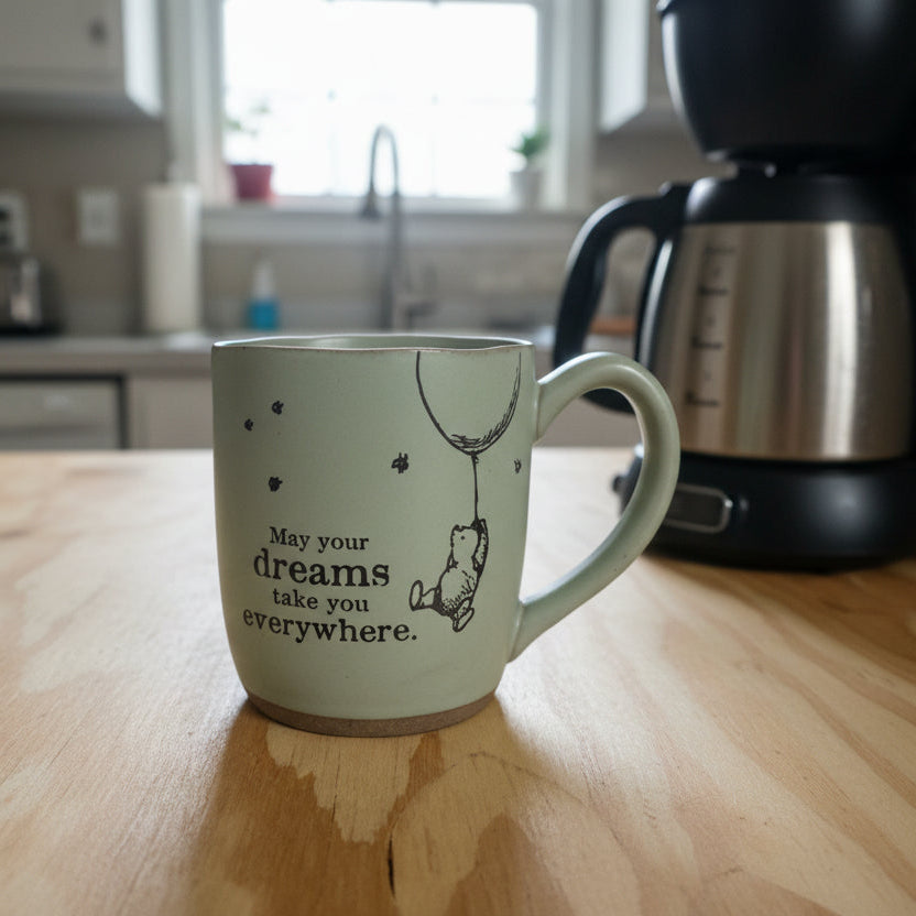 Mug with text and design on a wooden surface