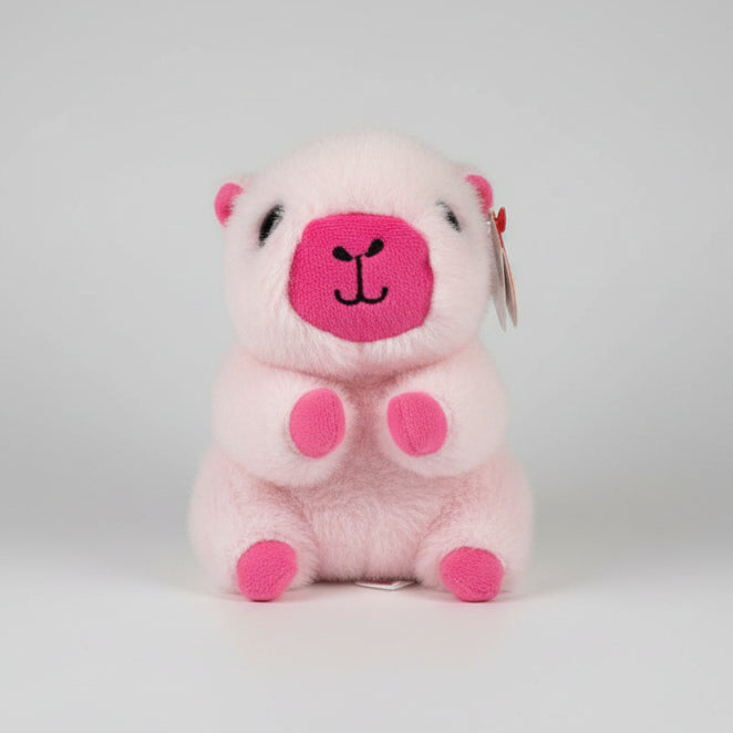 Plush toy llama with pink face and feet on a wooden floor