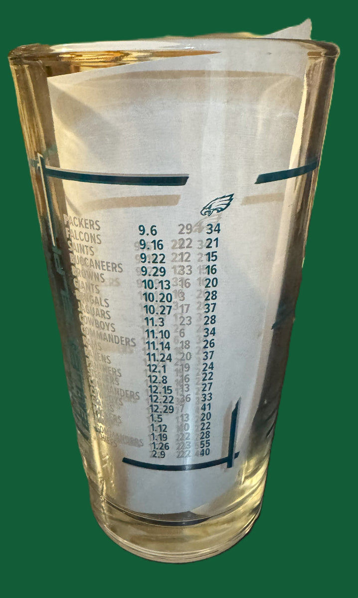 Glass with 'Super Bowl LIX Champions' text and logo on a white background