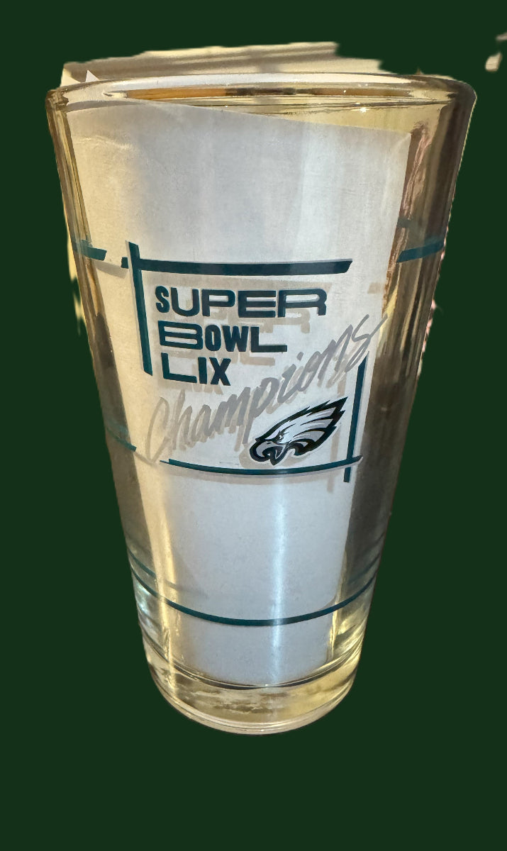 Glass with 'Super Bowl LIX Champions' text and logo on a white background