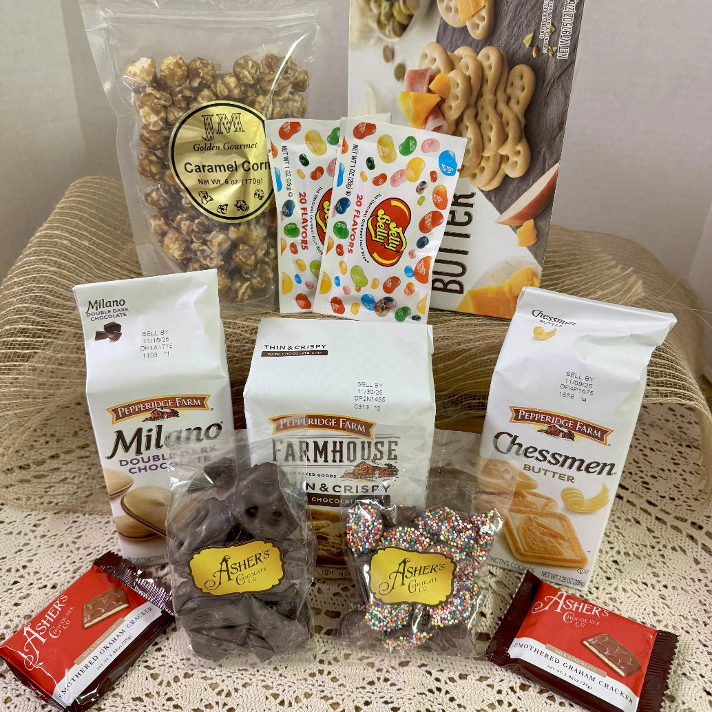 Gift basket with snacks in a Phillies-themed bucket on a white background