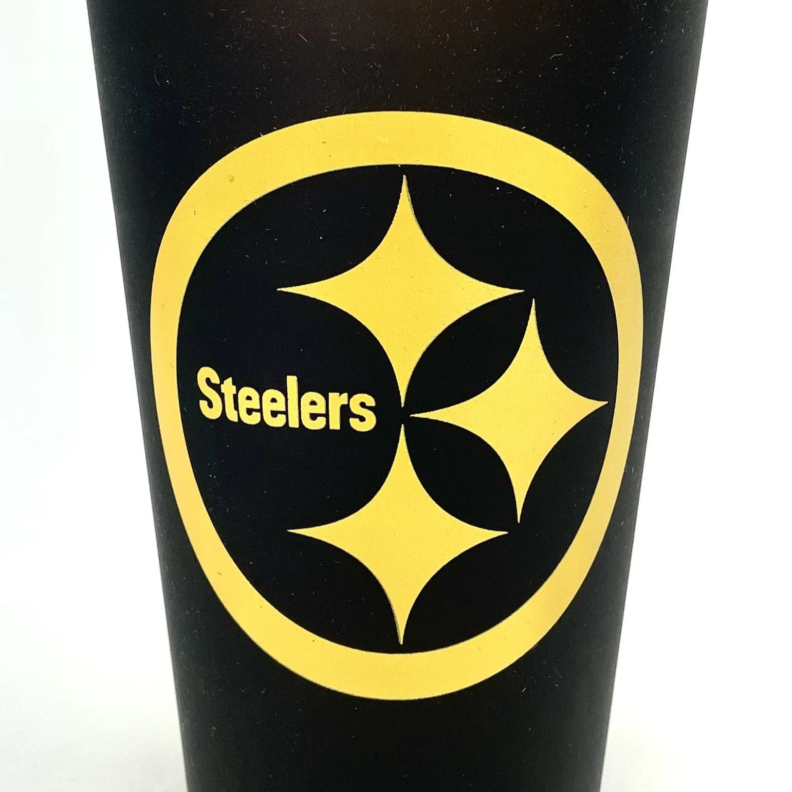 Black tumbler with yellow Steelers logo on a white background