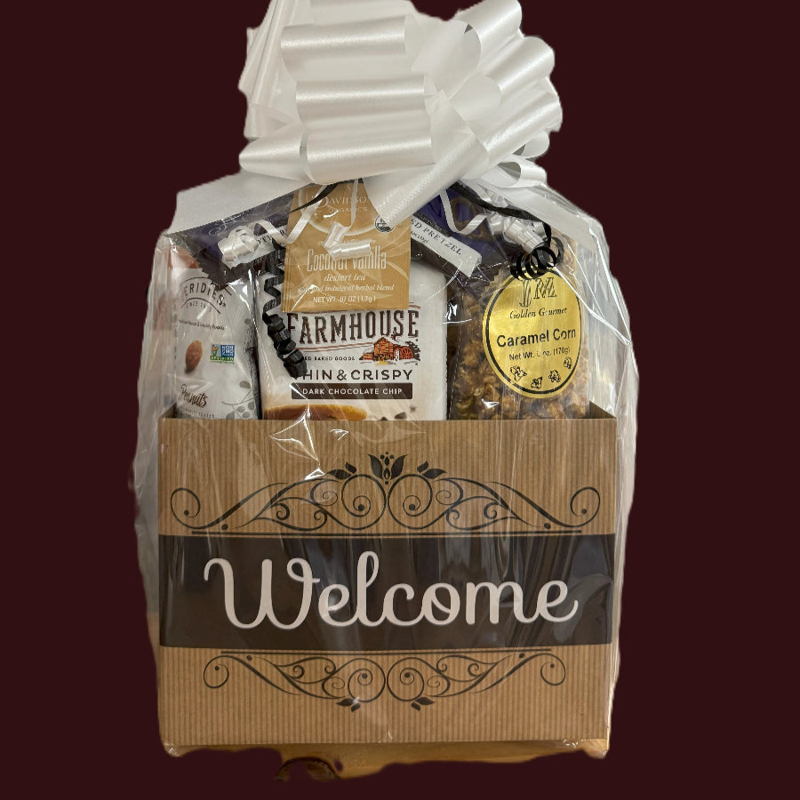Gift basket with a 'Welcome' label on a dark background