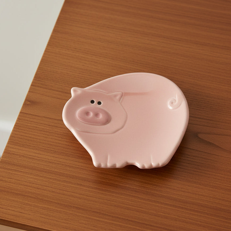 Pink pig-shaped object on a white background