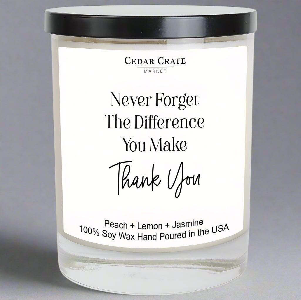 Candle with a label from Cedar Crate Market on a gray background