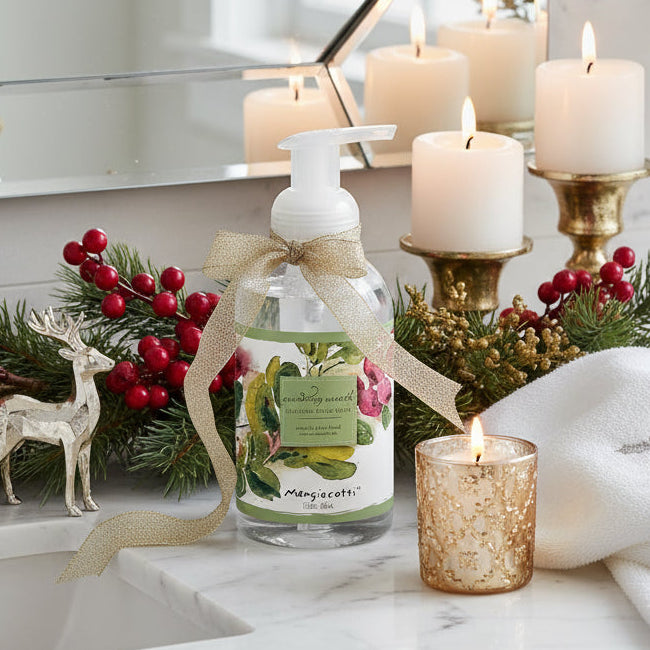 Foaming hand wash bottle with floral design on label against a white background