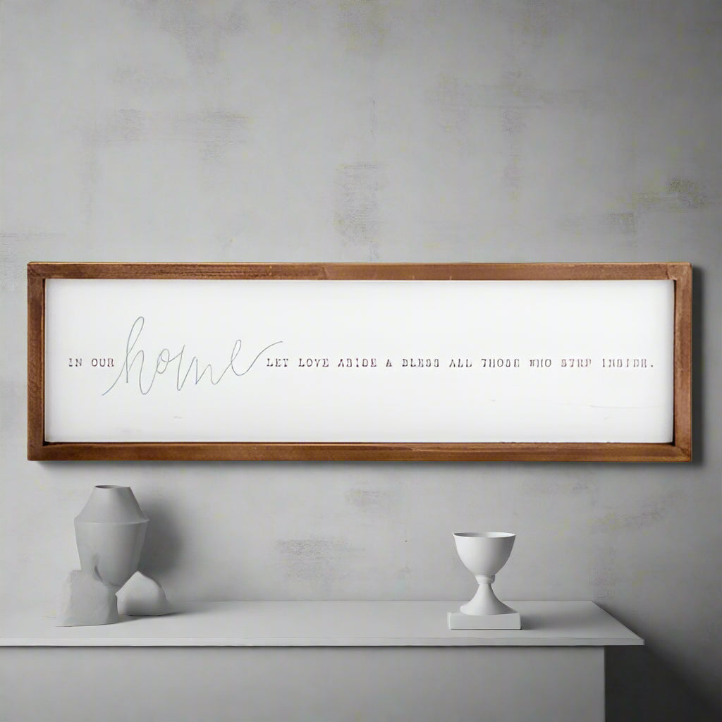 Wooden-framed sign with text on a white background
