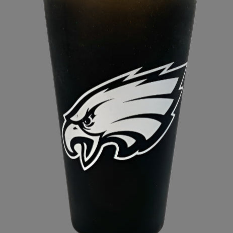 Black tumbler with a white eagle logo on a gray background