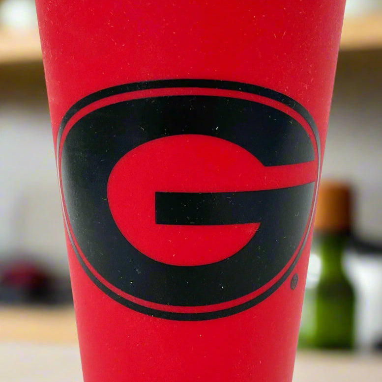 Red cup with a black logo on a white background