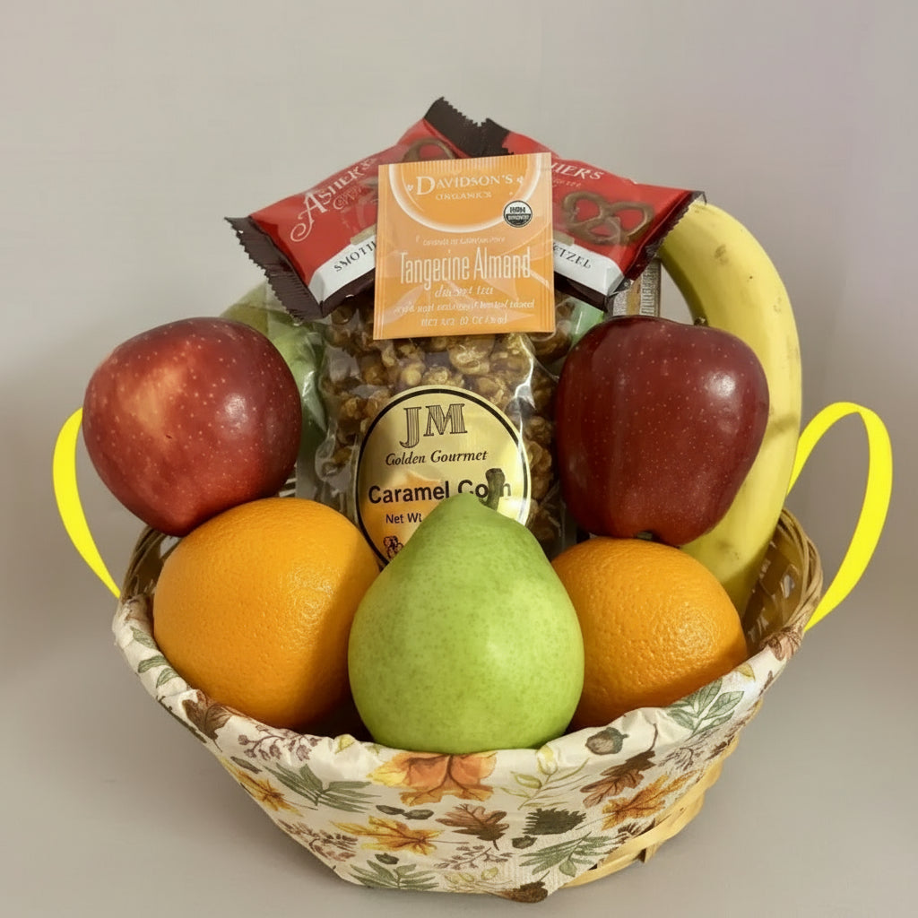 Fruit basket with apples, oranges, pears, and a small bag of chips on a wooden surface.