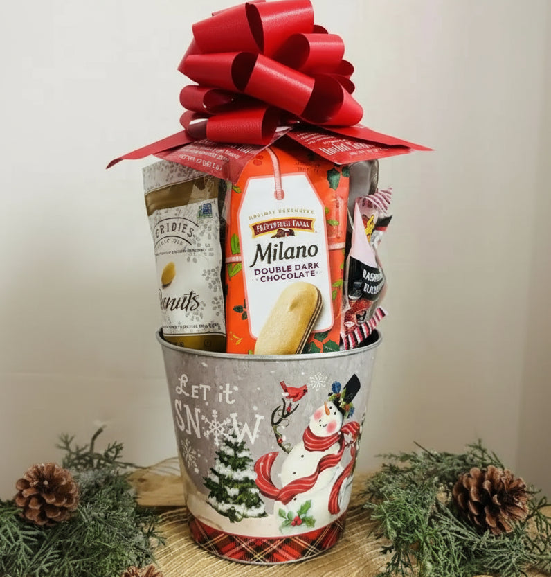 Gift basket with Milano cookies, Pringles, and other snacks in a decorative container with a red bow.