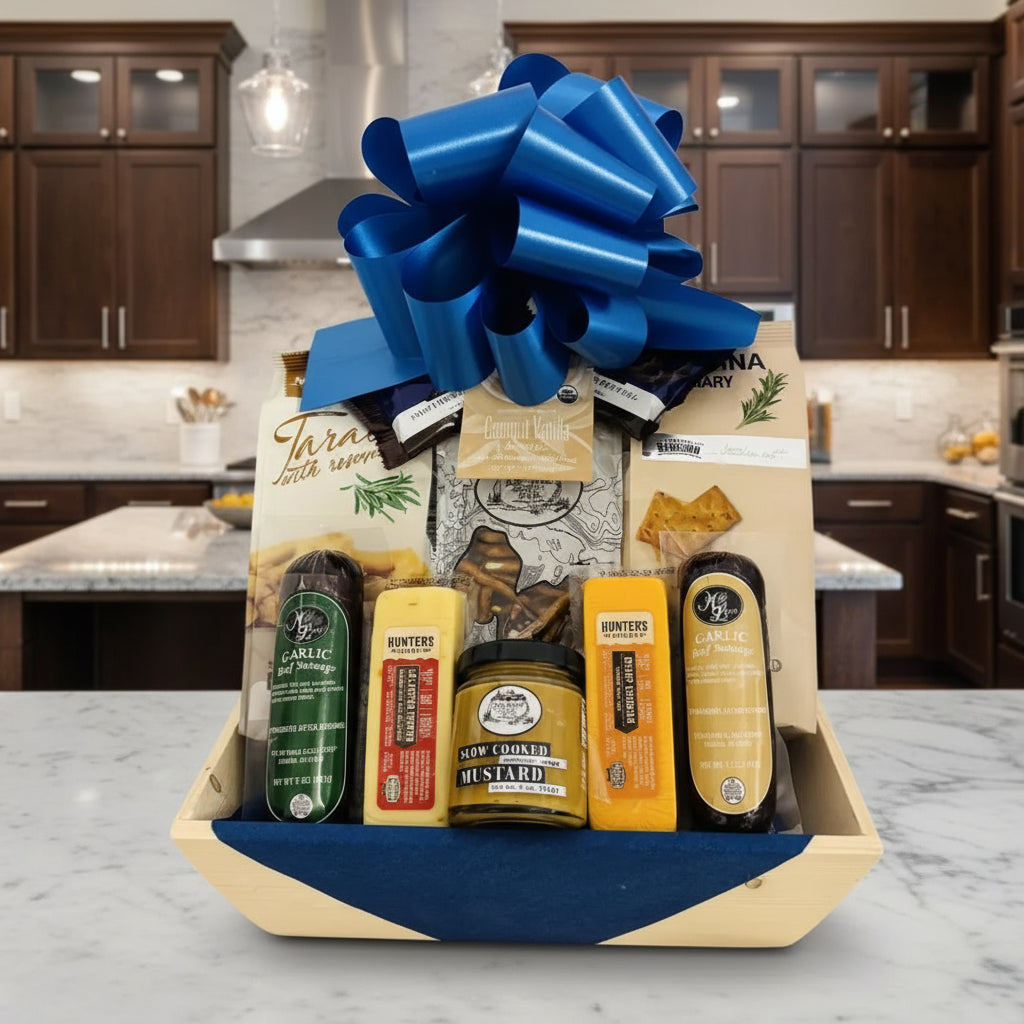 Gift basket with a blue bow containing various items on a wooden surface.