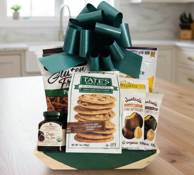 Gift basket with snacks and cookies on a wooden surface