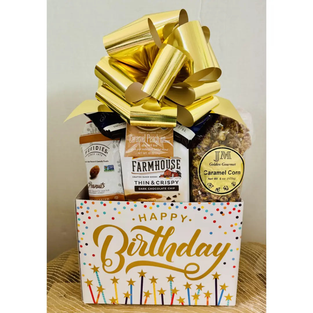 Gift basket with snacks and a purple bow, labeled 'Happy Birthday', on a neutral background.