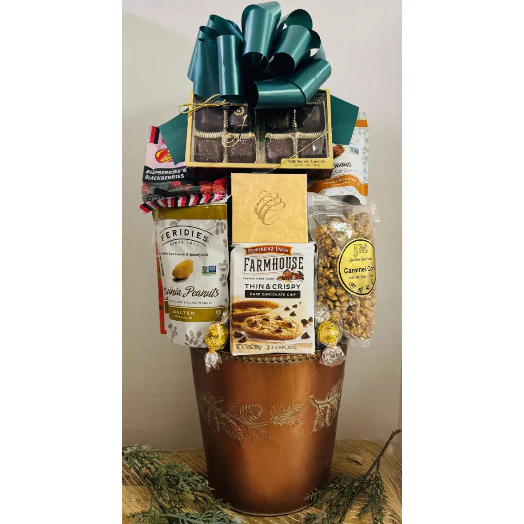Gift basket with various snacks and treats on a white background