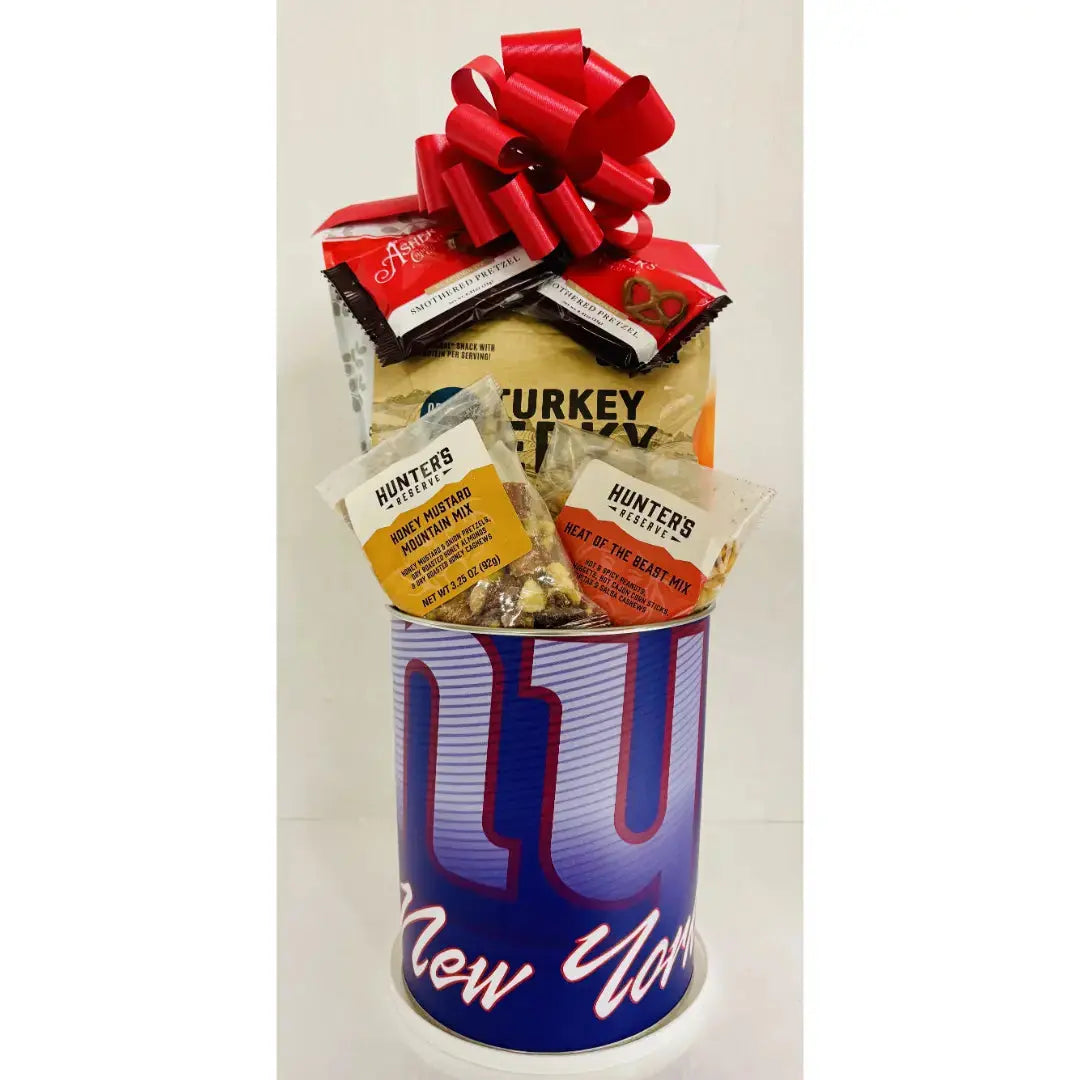 Gift basket with snacks in a New York Giants can on a white background